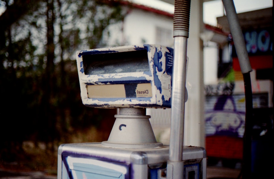 Old, weathered gas pump with graffiti